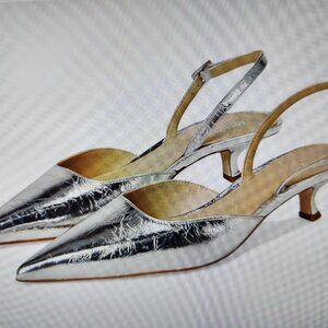 Michael Kors "Luna" Silver Sling Pumps. NIB. Size 7. Floor model.